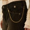 SOUVENIR Jeans nero gamba dritta con risvolto e accessorio